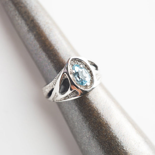white Gold engagement ring with blue topaz