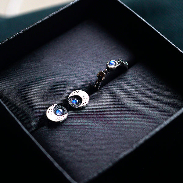 Crescent Black Moon Stud Earrings, crafted with utmost precision from sterling silver and adorned with natural rainbow moonstone by moonique
