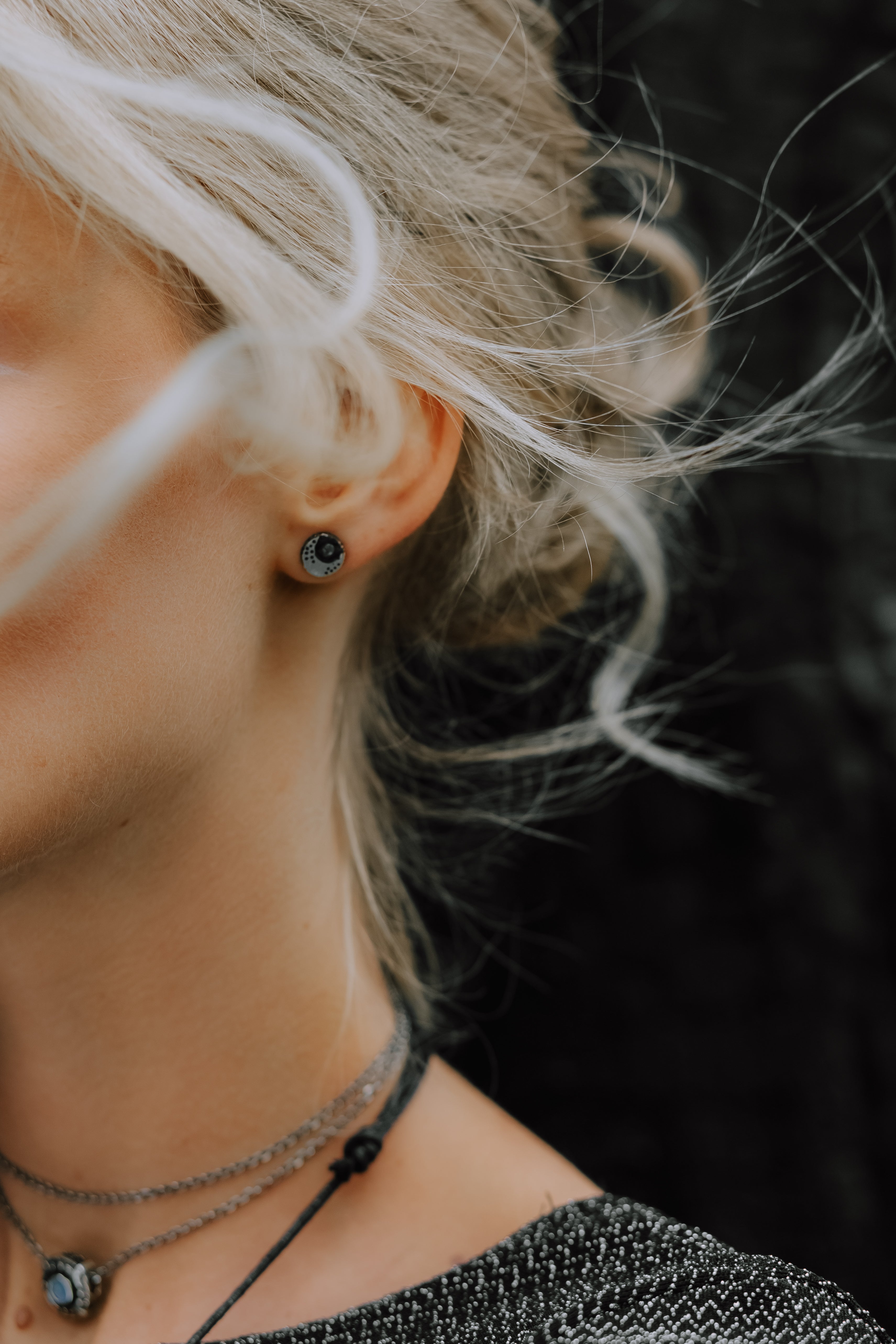 Crescent Black Moon Stud Earrings, crafted with utmost precision from sterling silver and adorned with natural rainbow moonstone by moonique