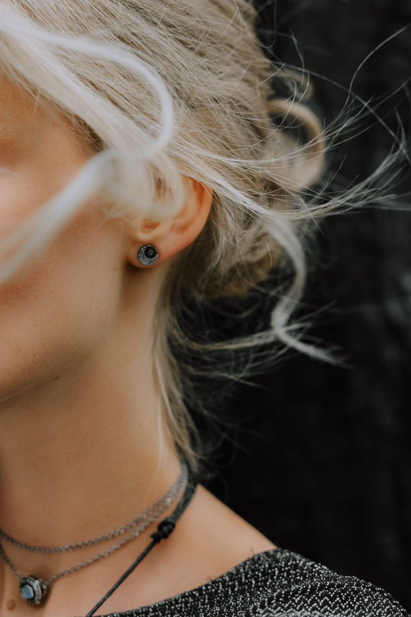 Crescent Black Moon Stud Earrings, crafted with utmost precision from sterling silver and adorned with natural rainbow moonstone by moonique